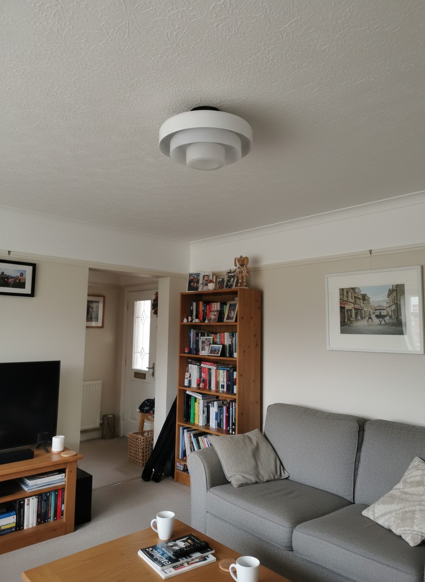 Customer living room with a white Veleora Bauhaus ceiling lamp