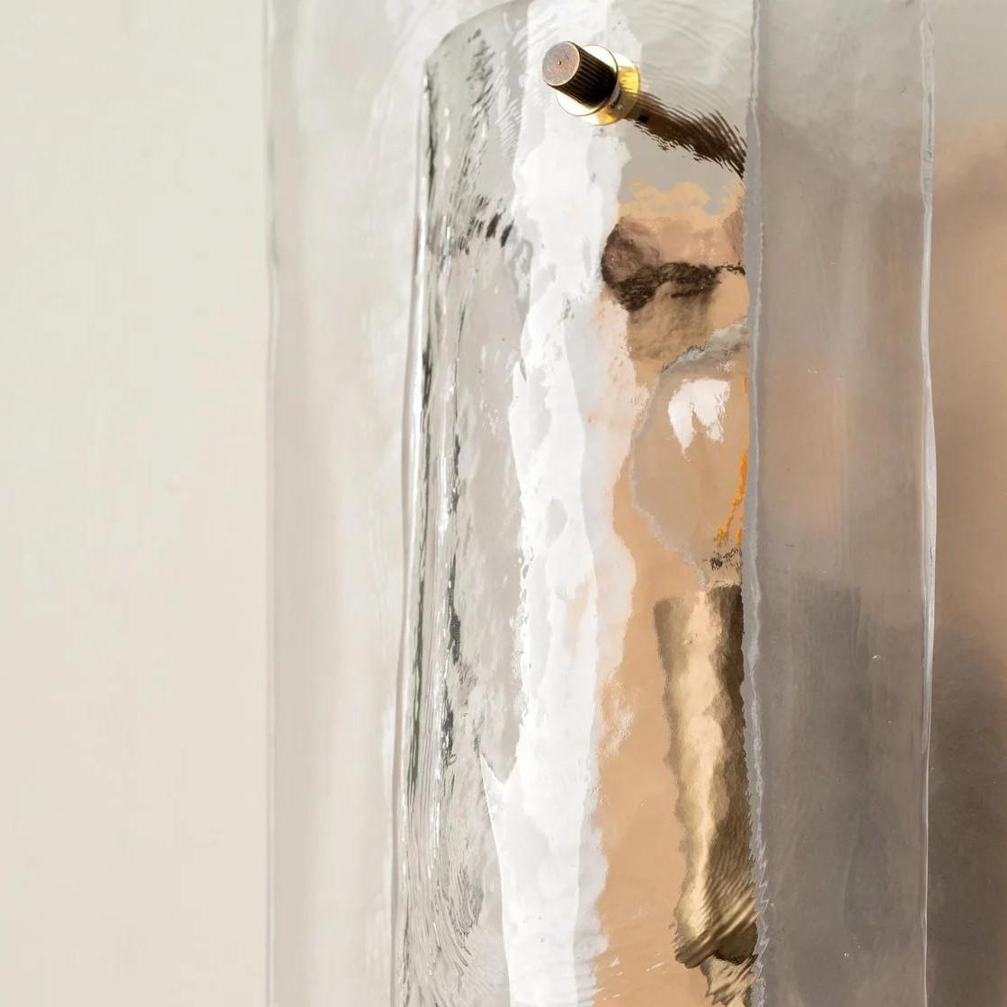 Close view showing the sculptural glass layering and warm glow