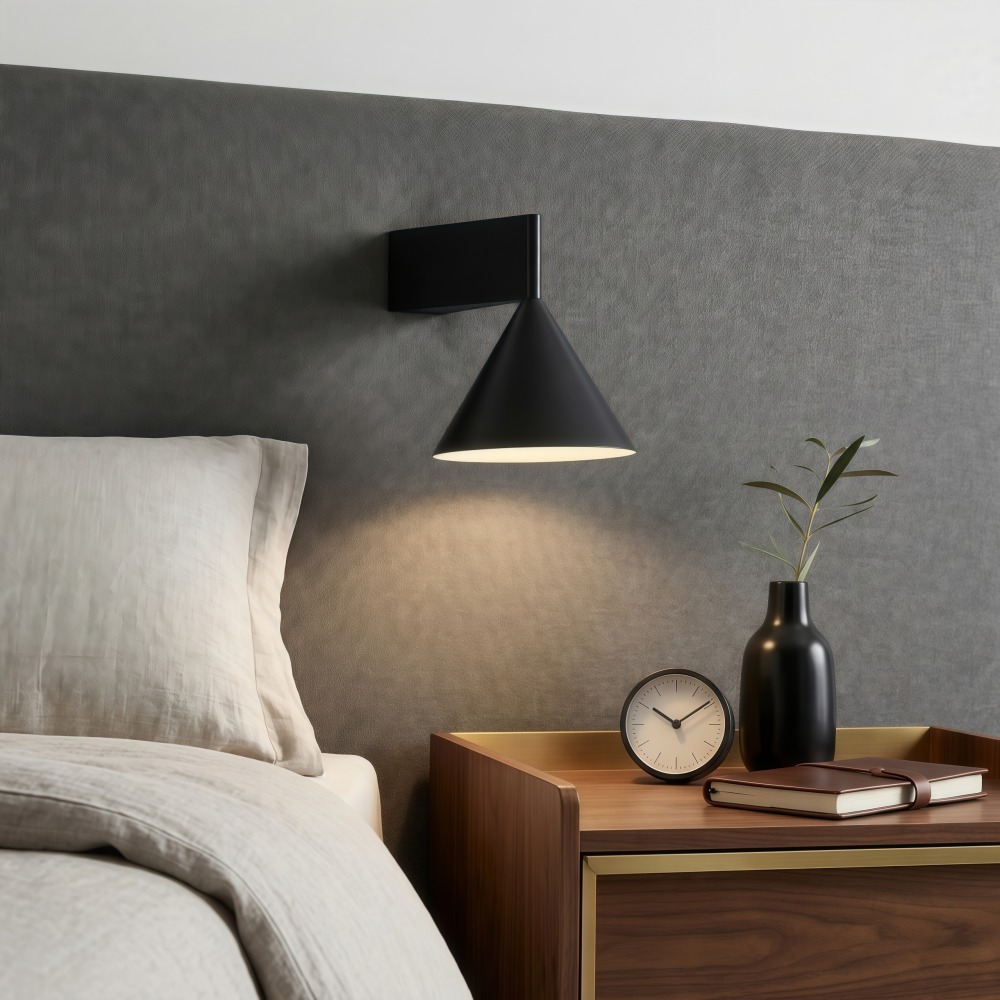 Metorq wall lamp beside a bed