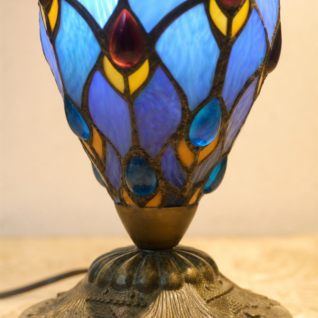 Close-up detail of the blue stained glass lamp body