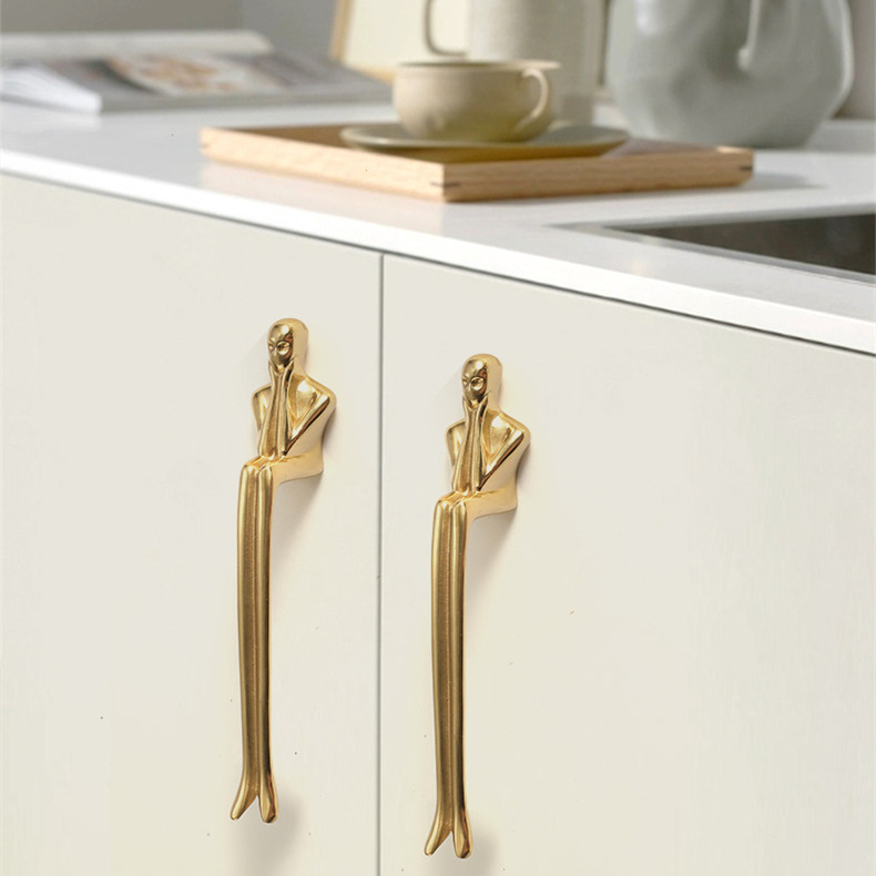 Brass Verlitho handles on a light cabinet