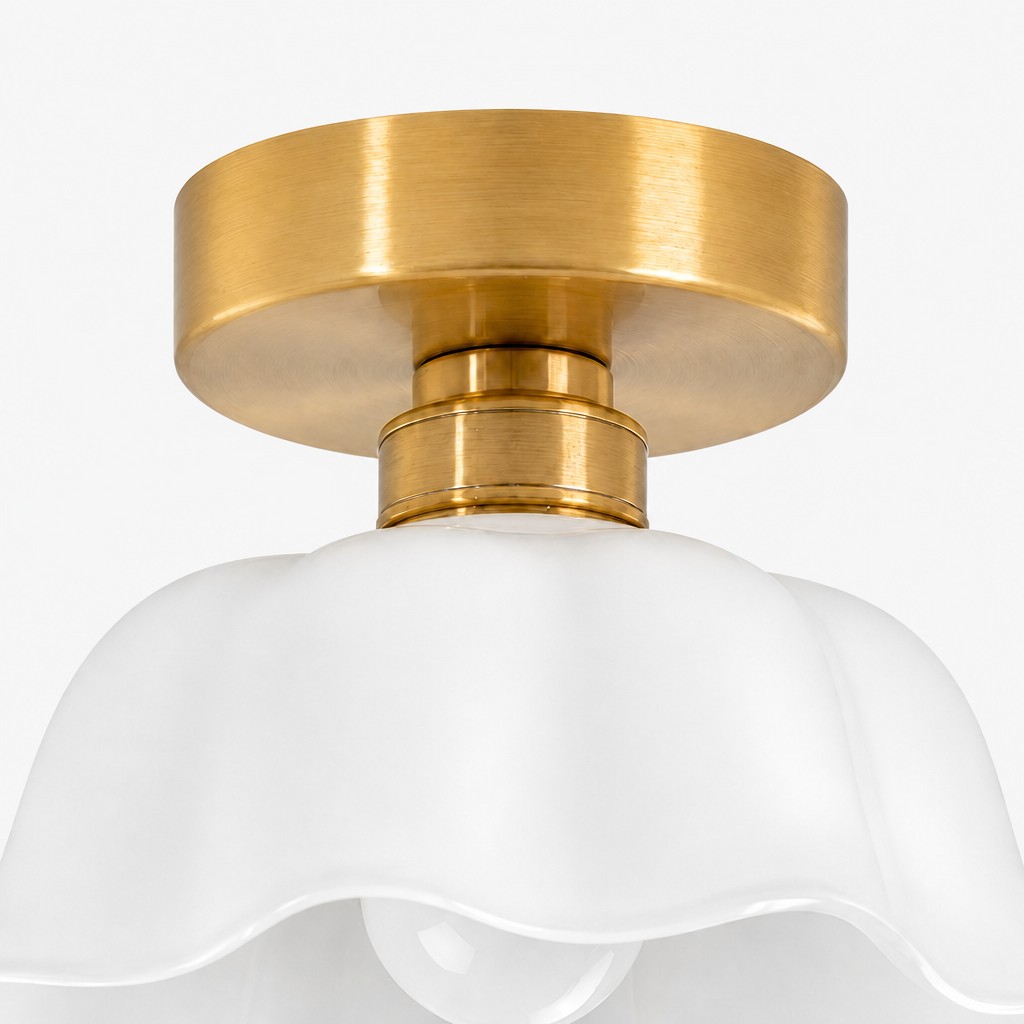 Close-up of the flush mount brass canopy and white flower shade