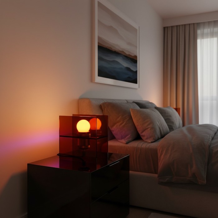 A modern luxury bedroom featuring a crystalline acrylic sunset lamp projecting deep orange and violet gradients across a minimalist wall.