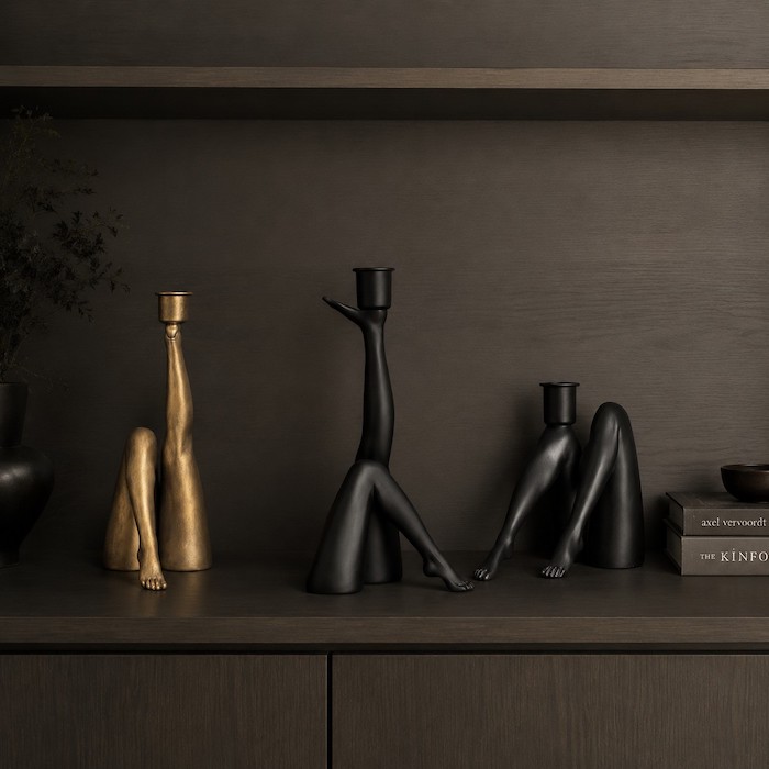 An organized interior shelf displaying curated sculptural decor surrounded by generous negative space