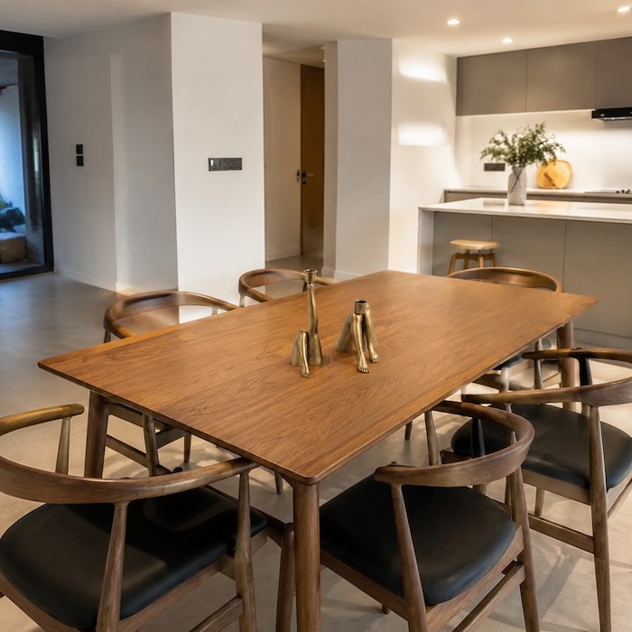 A spacious but slightly stark open-concept dining room needing ambient character
