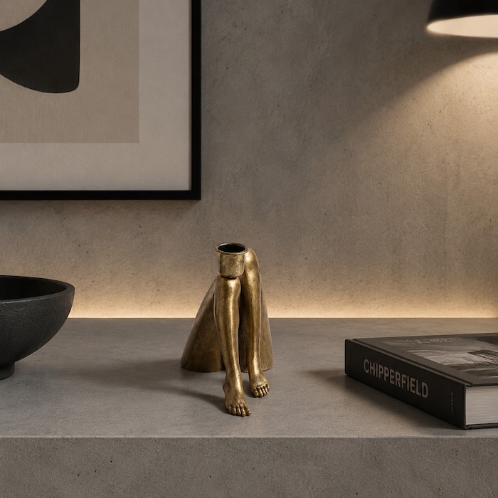 Industrial-style room with matte black human-form decor.