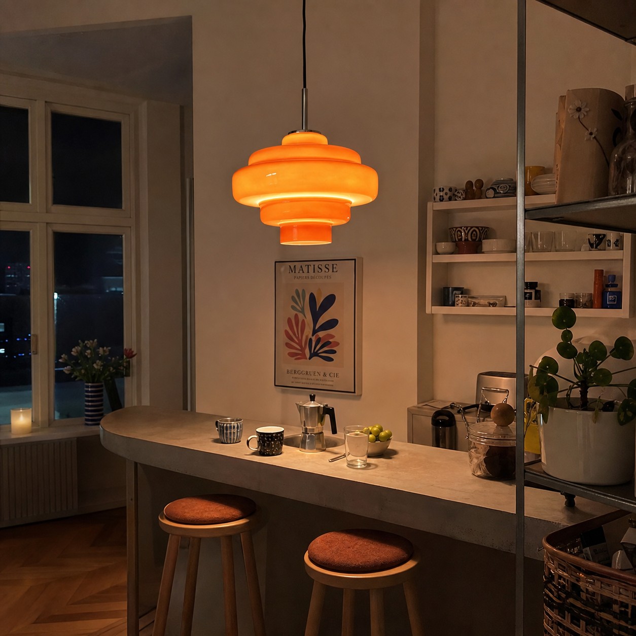 Warm pendant glow over a breakfast bar in the evening.