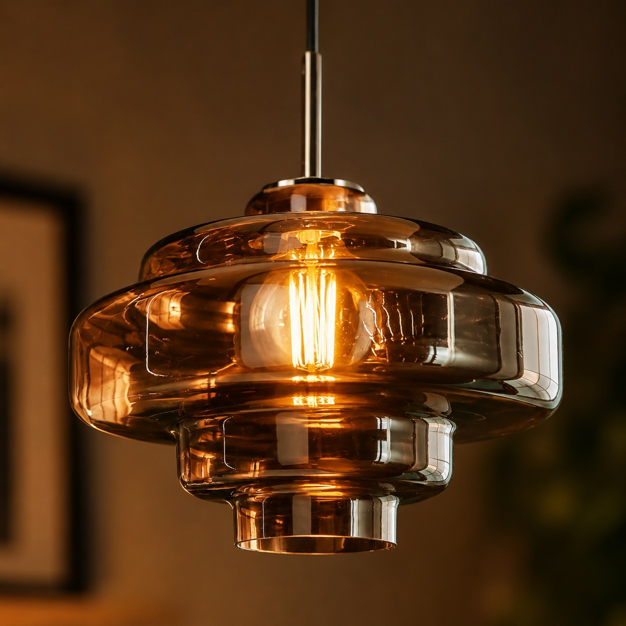 Warm vintage filament bulb glowing inside a retro colored glass lamp shade
