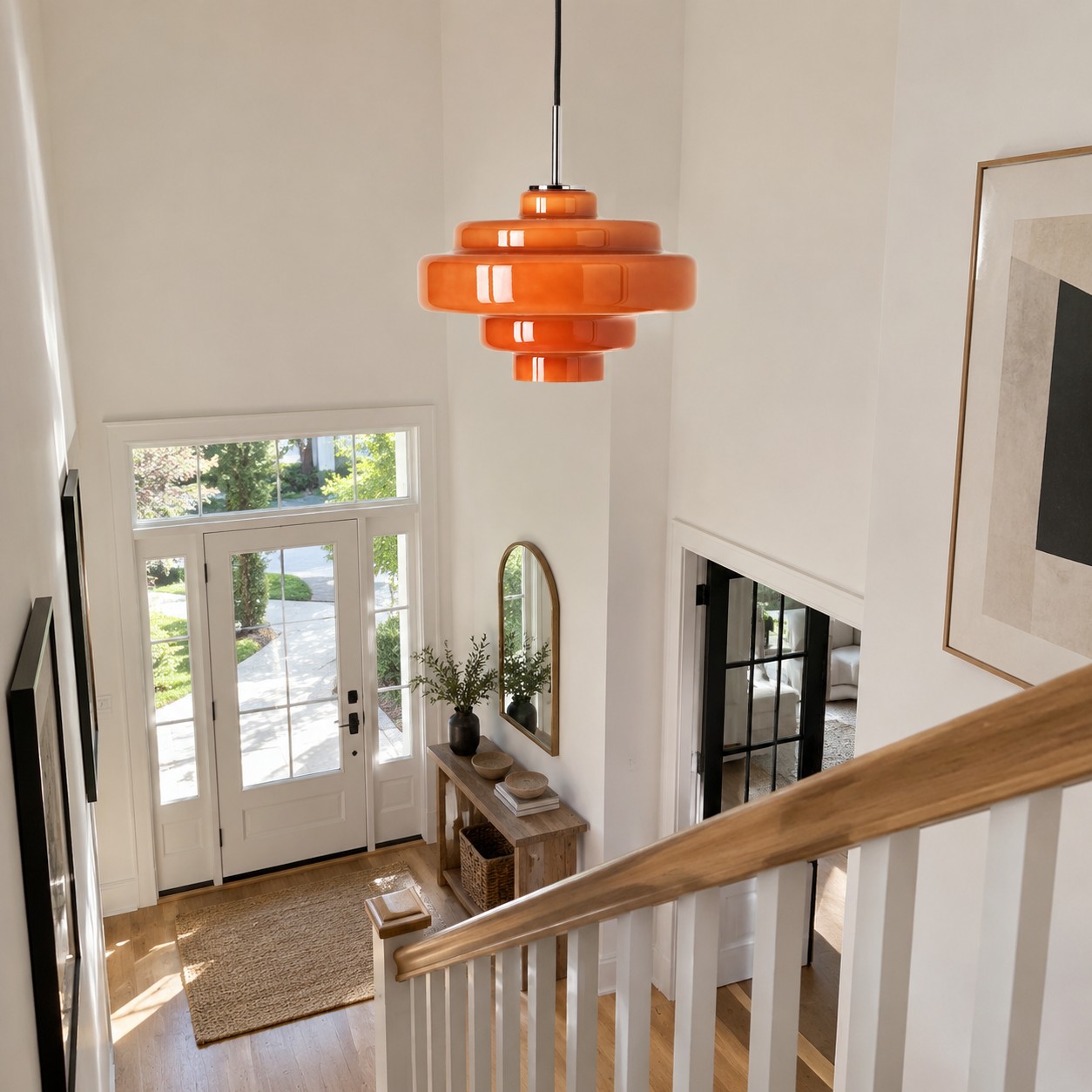 Landing pendant placed without blocking artwork or the entrance sightline.