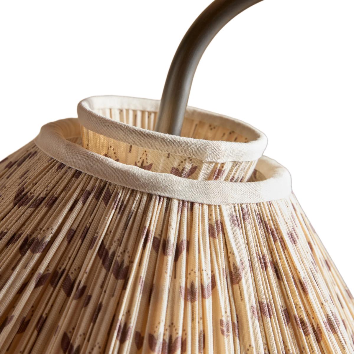 Detail of the curved gooseneck fitting and pleated shade