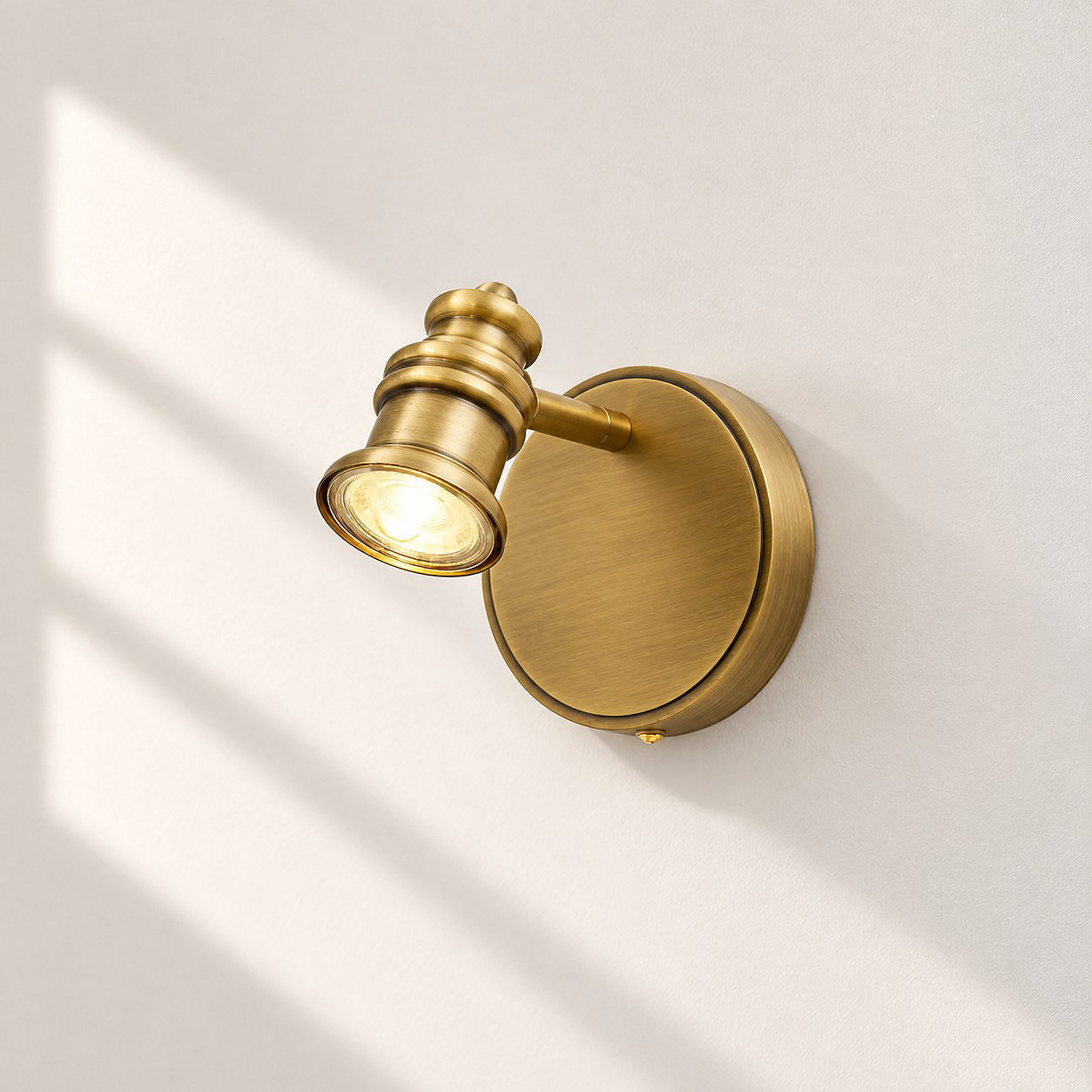 Aurelia Adjustable Natural Brass Wall Light | Sculpted Heads — A natural perspective