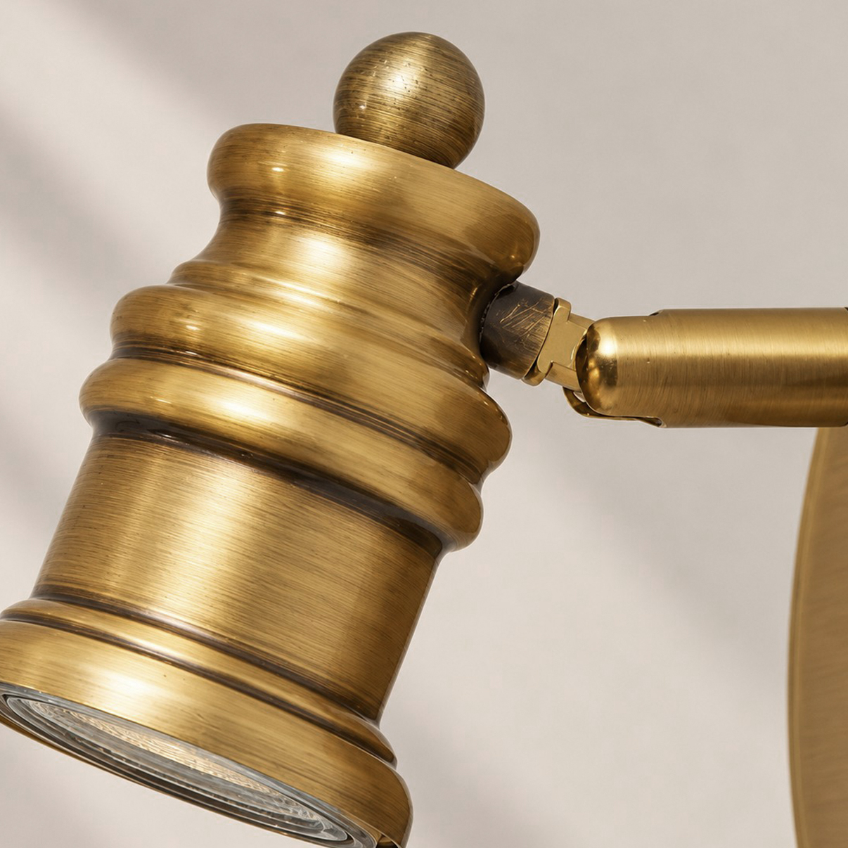 Aurelia Adjustable Natural Brass Wall Light | Sculpted Heads — A natural perspective