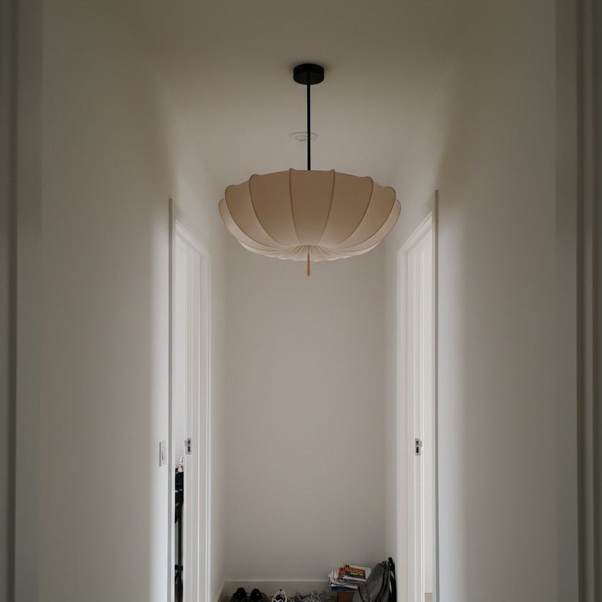 Customer hallway photo with round chandelier