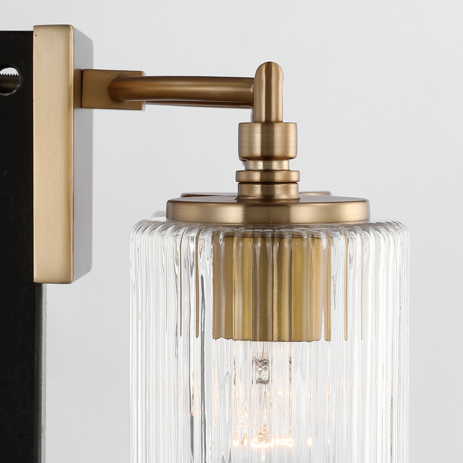 Close view of the brass finish and glass shade