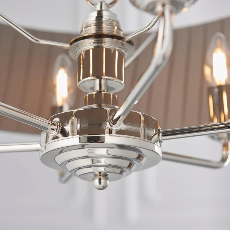 Close detail of Tela pendant metal arms