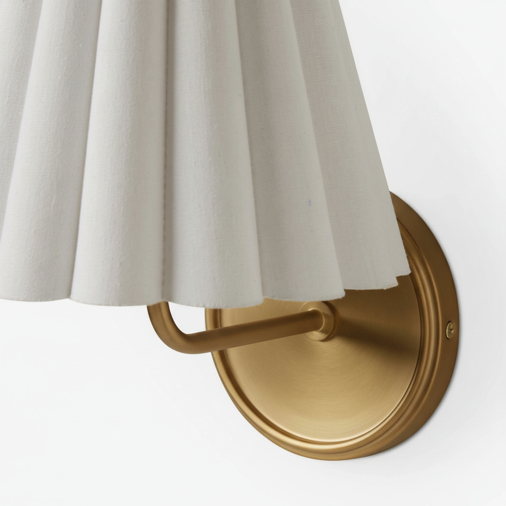 Close view of the brass metal frame and pleated shade