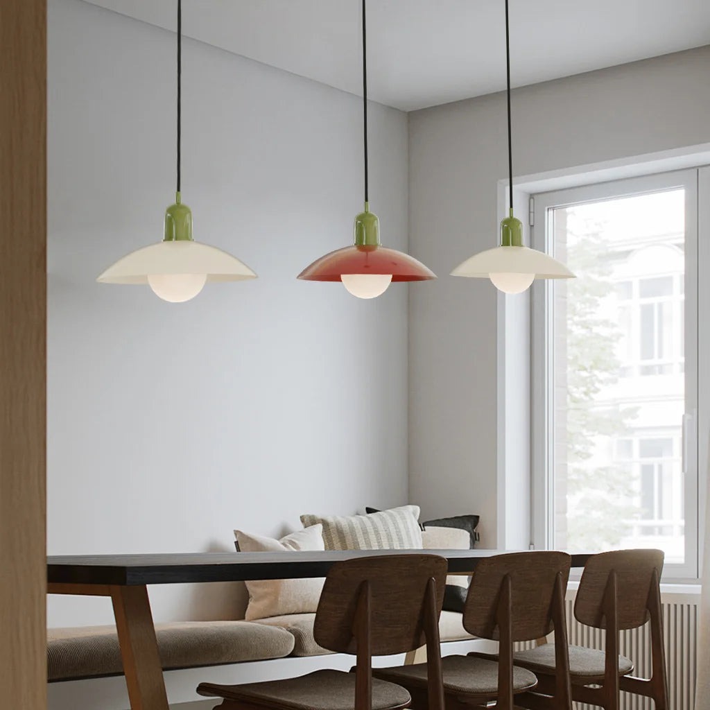 Macaron pendant lights over a dining table