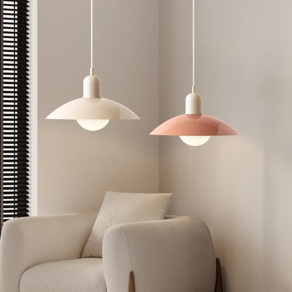 Macaron pendant lights beside a lounge chair
