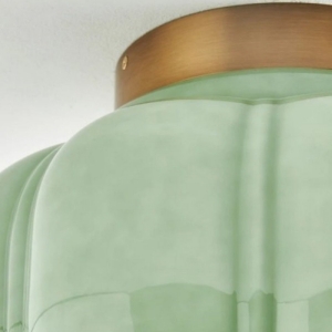 Close view of the milk glass shade and brass cap