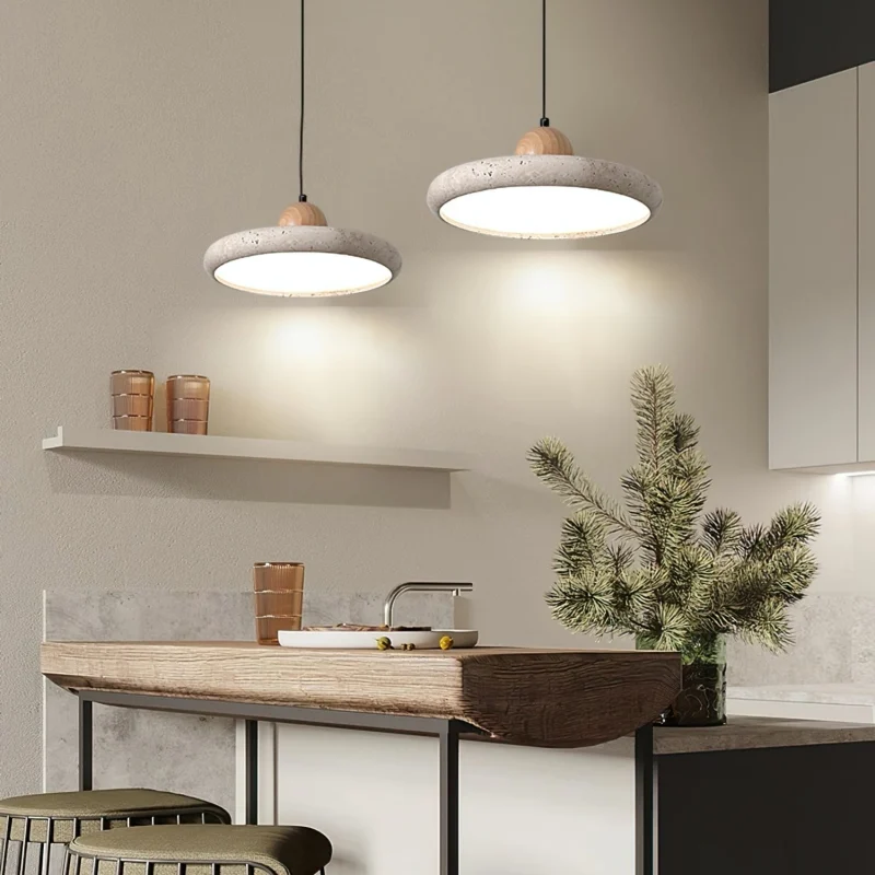 Travertine pendant lights above a side table