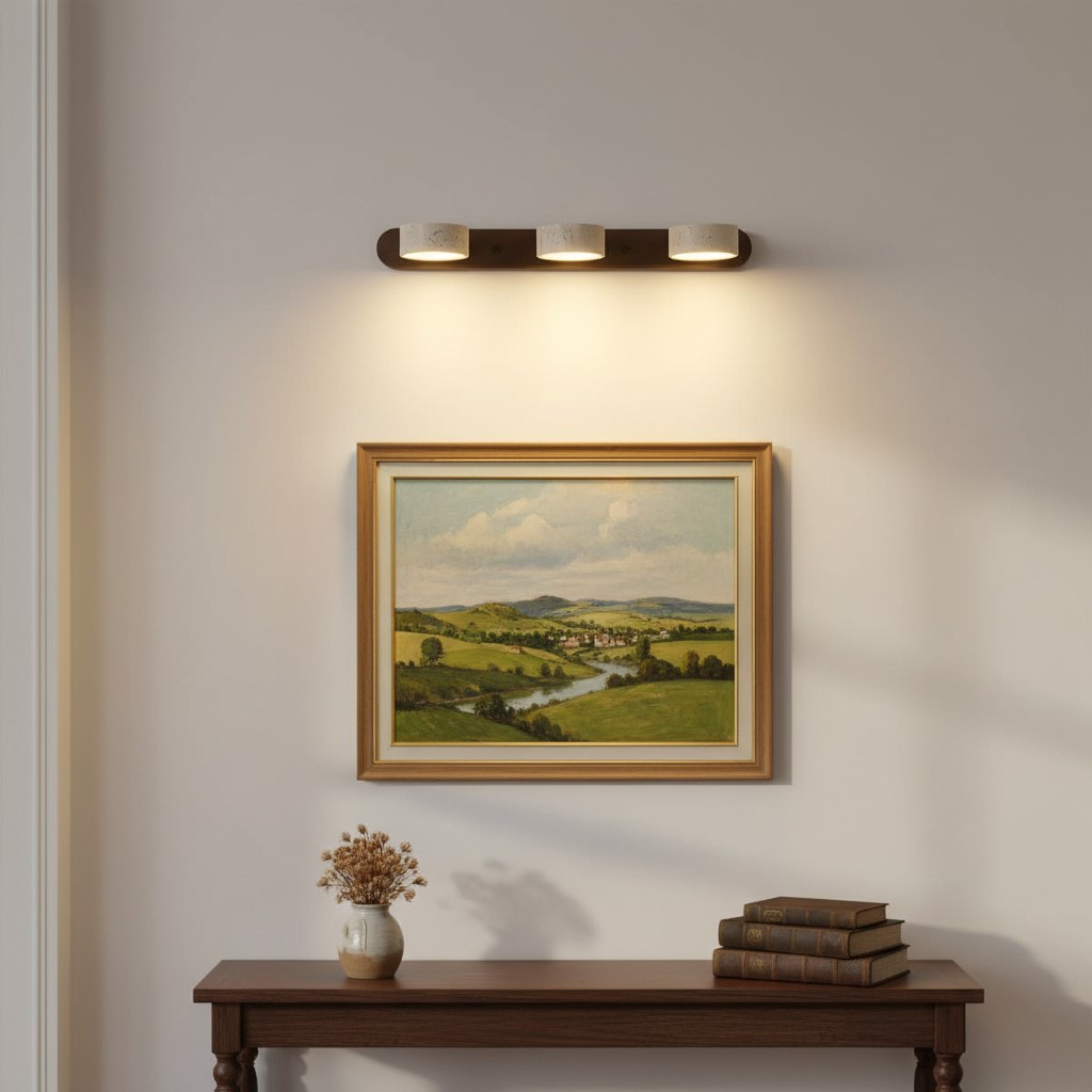 Travertine wall light illuminating landscape art