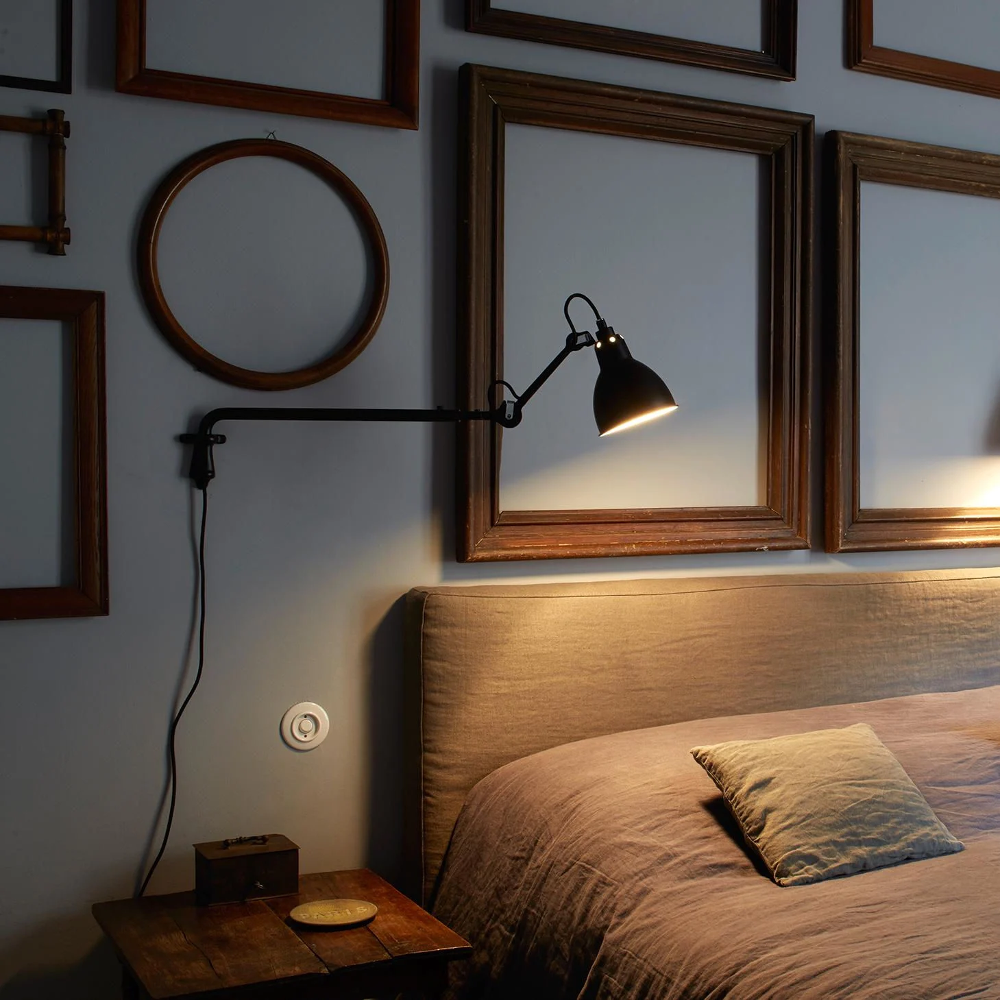 Wall lamp installed beside bed