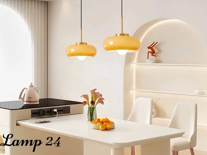 Pendant lights above a bright dining table