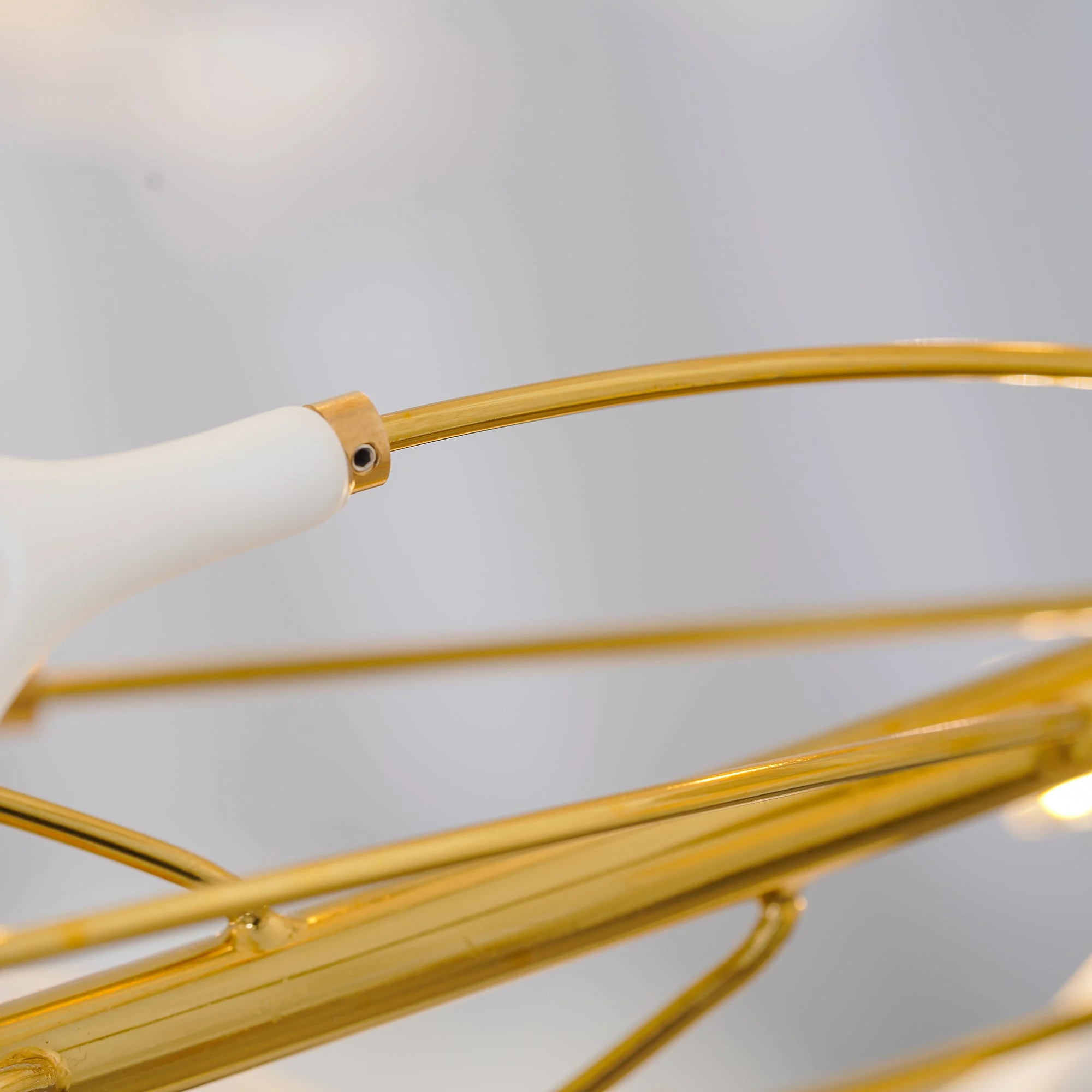 Gold metal branch detail of Gingko U Chandelier