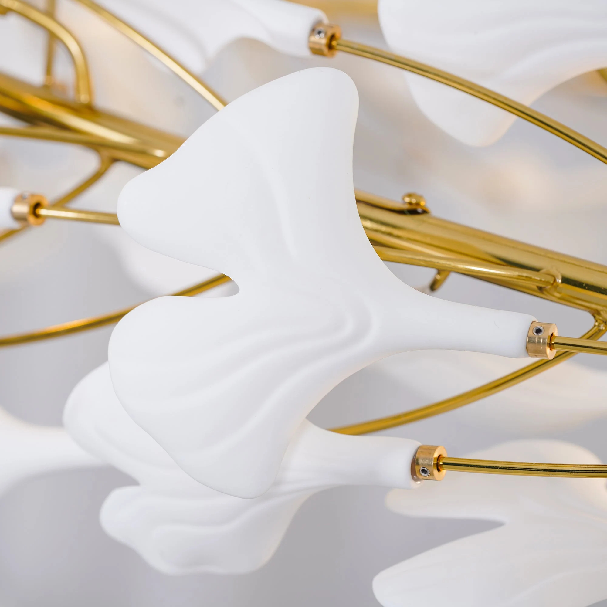 White porcelain leaves mounted on gold frame