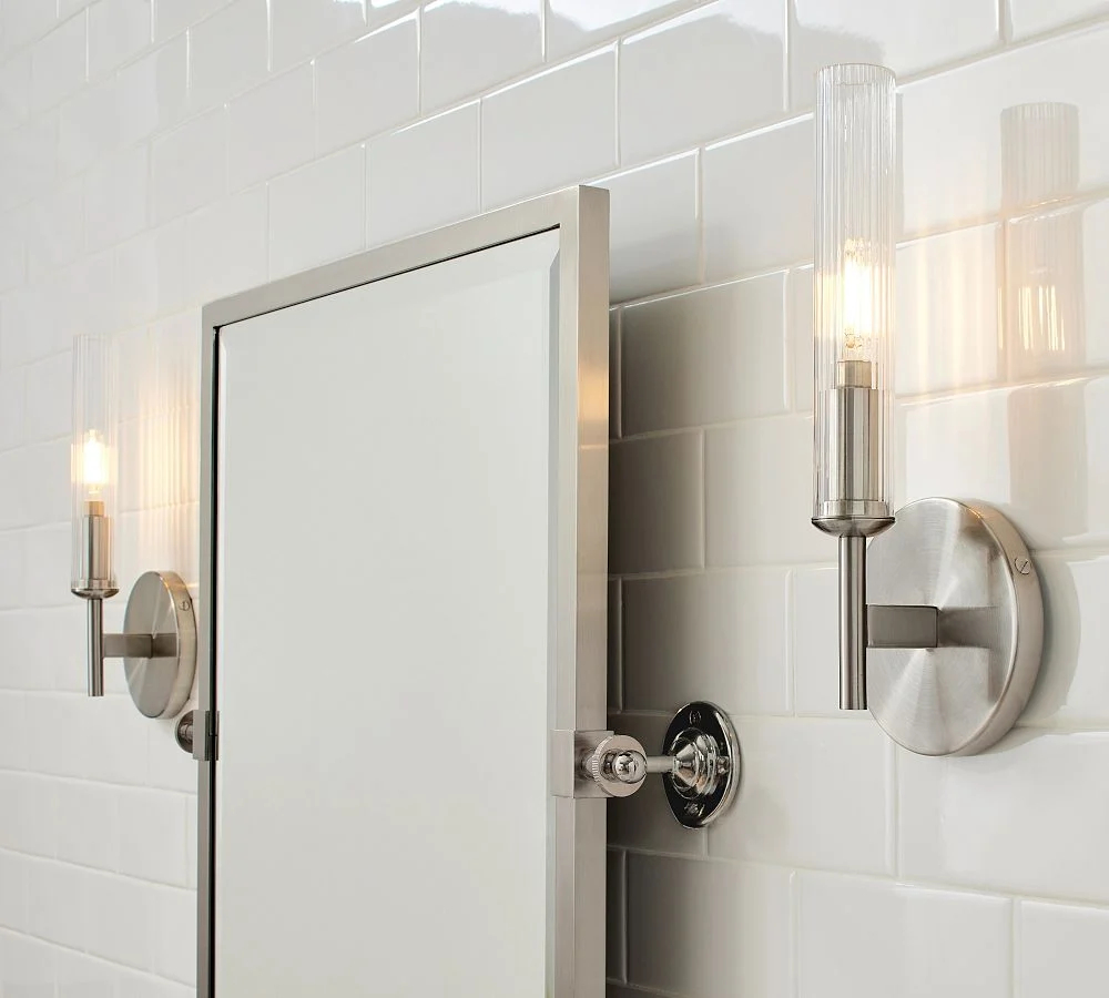 Bravira wall light installed beside a mirror