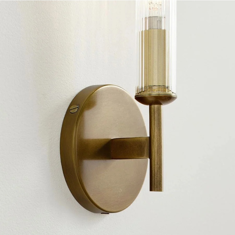 Tumbled brass ribbed glass wall sconce detail