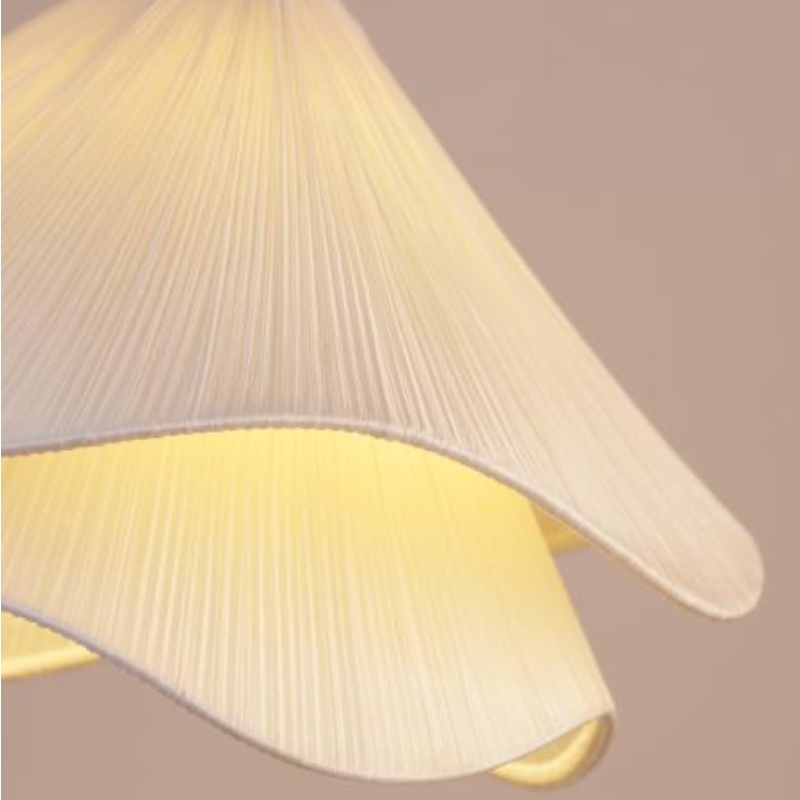 Warm illuminated pleated shade detail