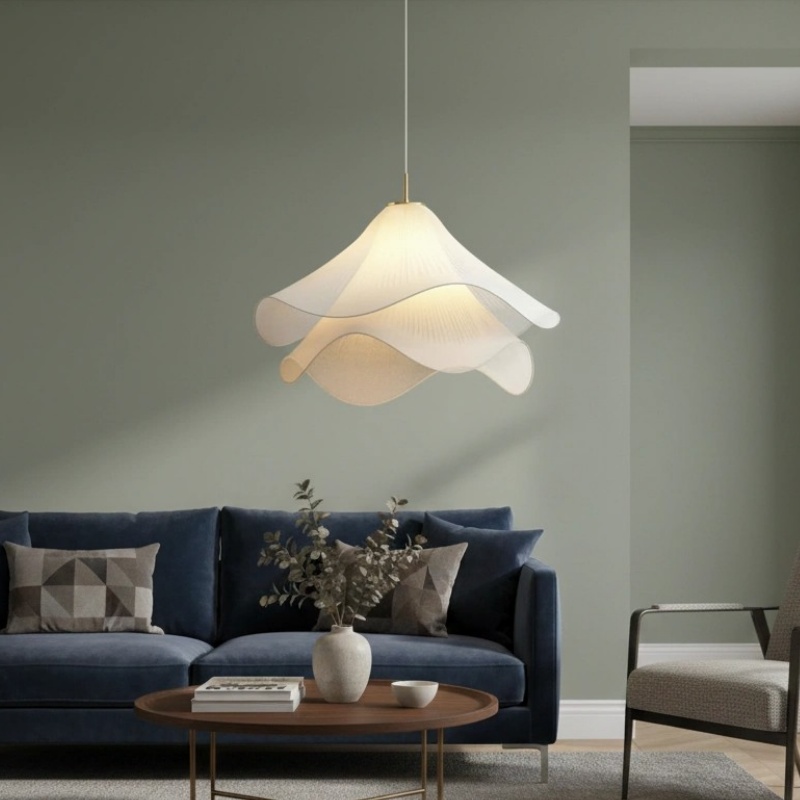 Pendant light above a blue sofa