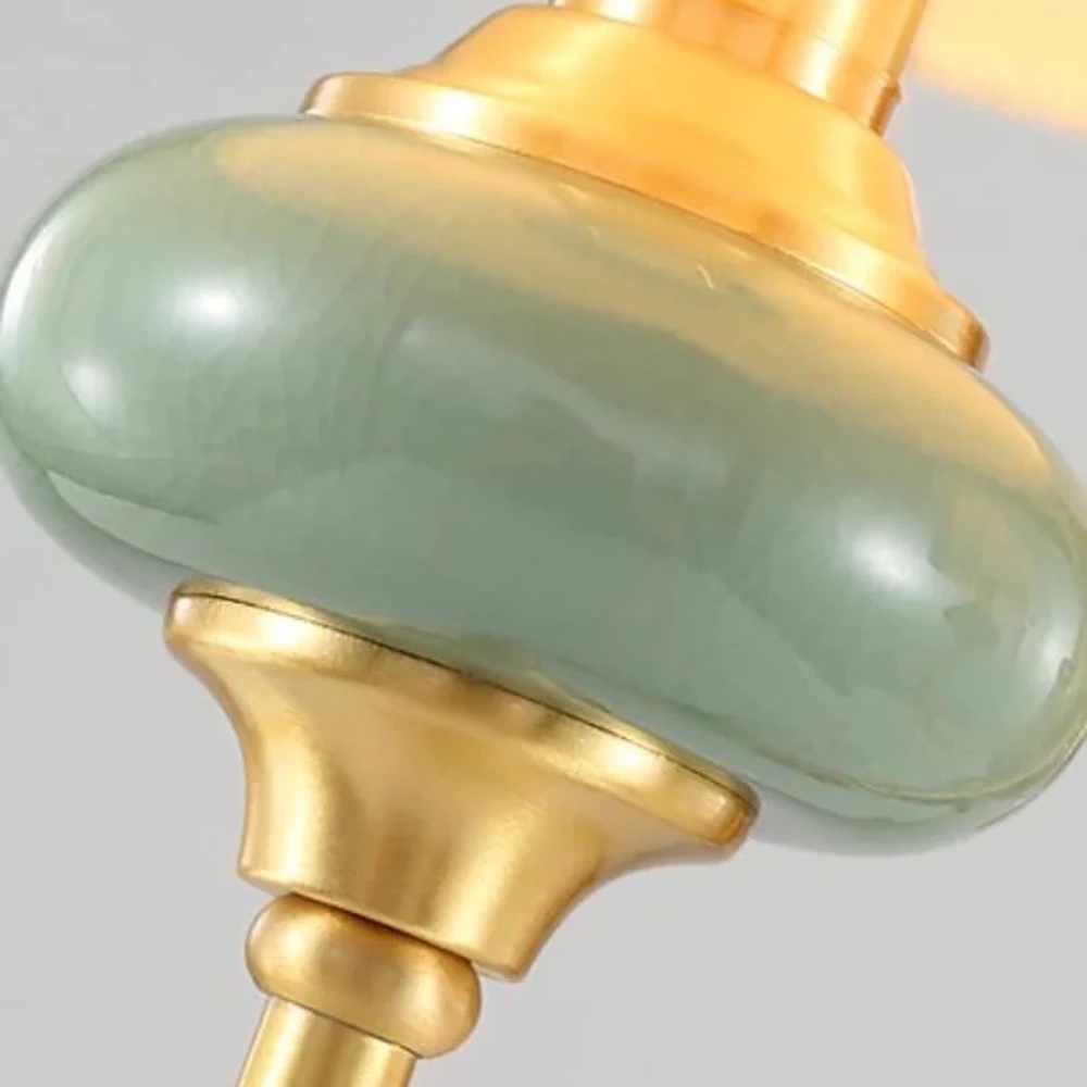 Close-up of green ceramic accent and gold stem