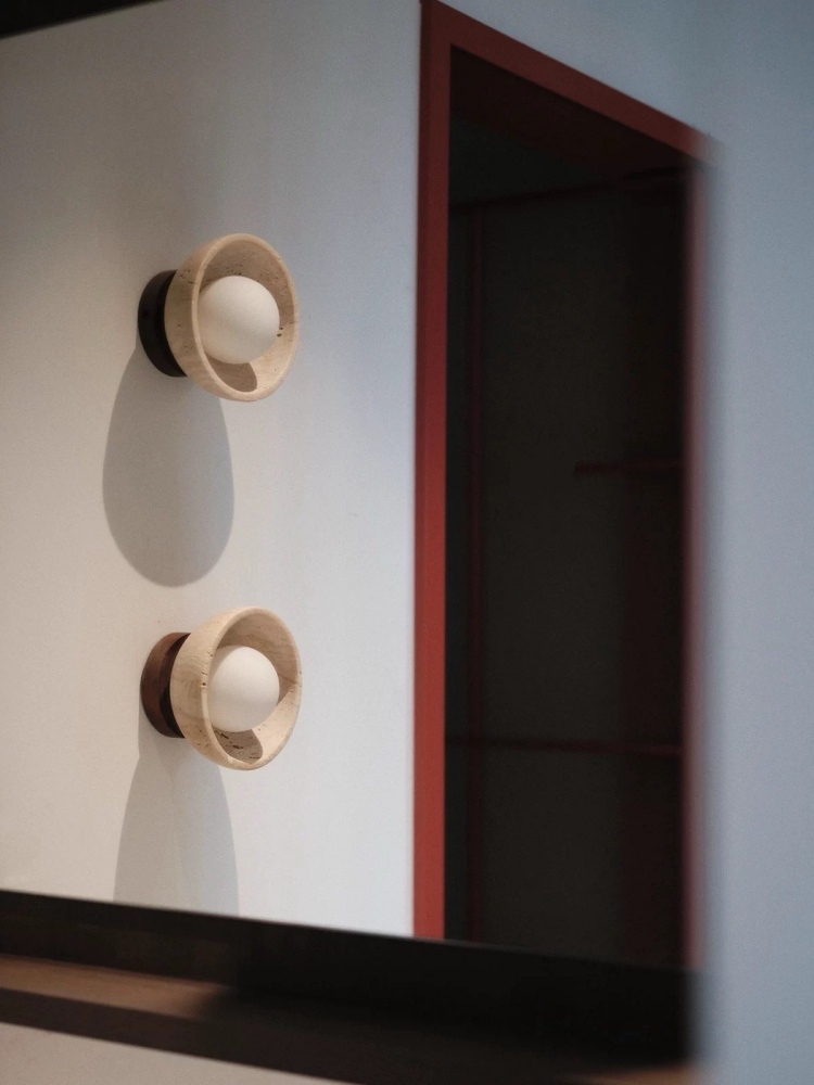 Customer scene showing two travertine wall lights