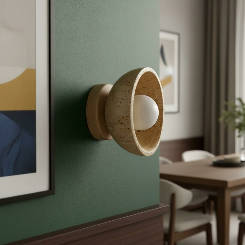 Travertine wall light close to framed art
