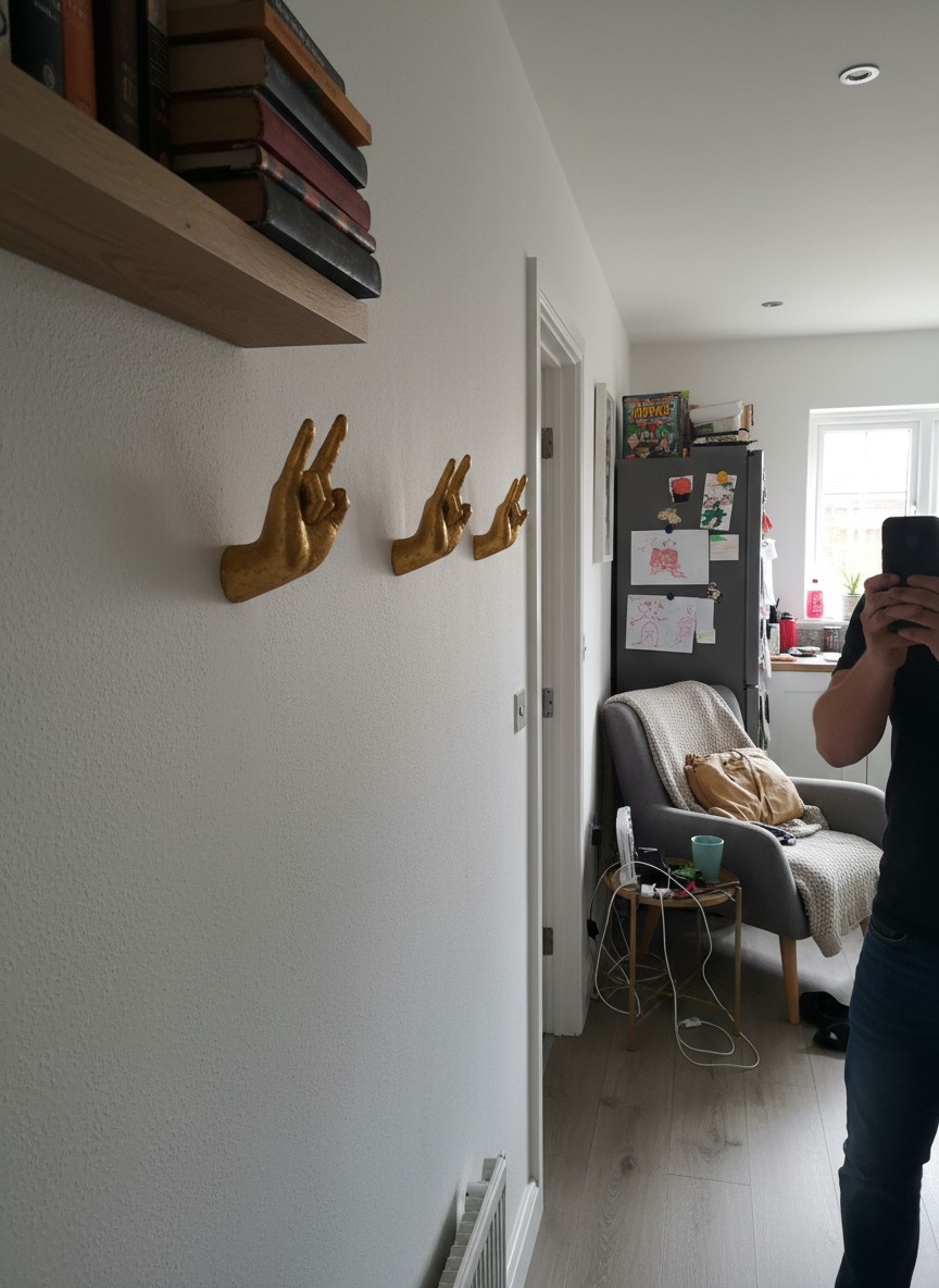 Customer photo showing multiple gold hand hooks installed