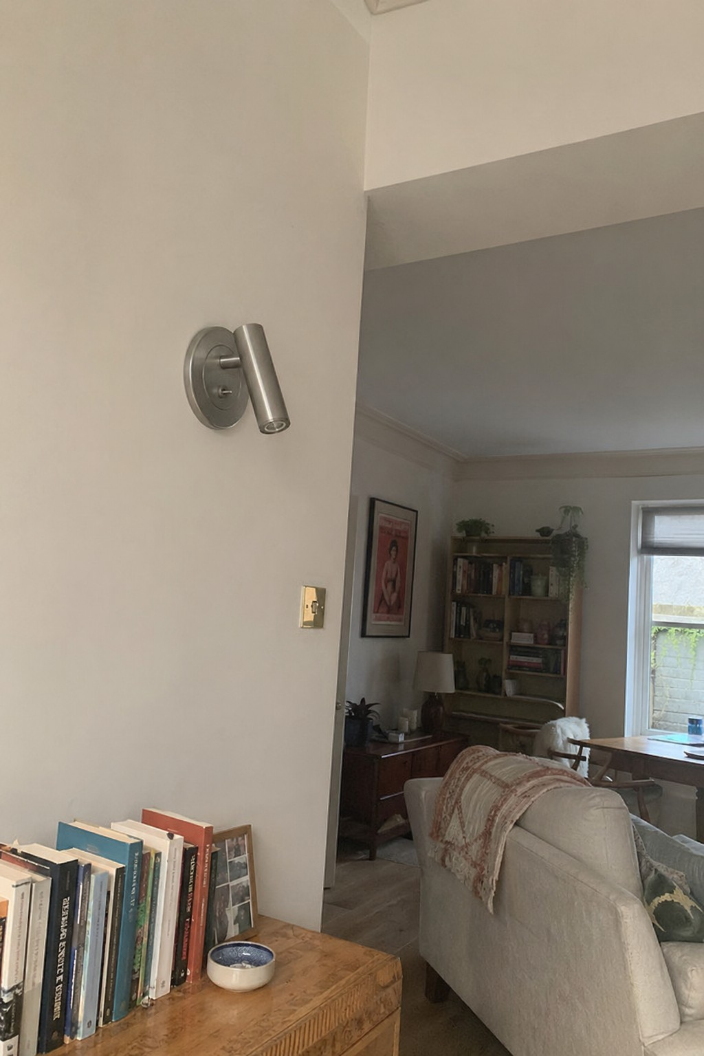 Customer photo of Slimlux wall light on a bedroom wall