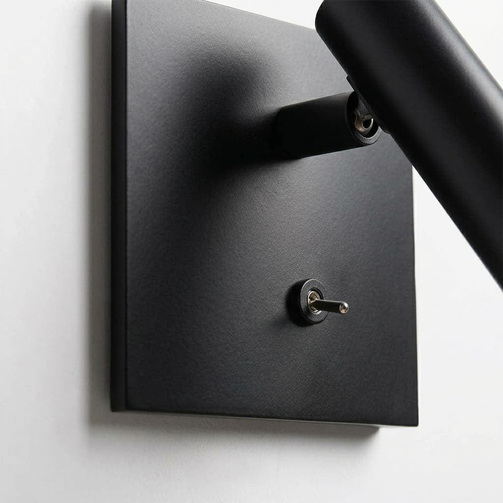 Close-up of Slimlux wall light plate and toggle switch