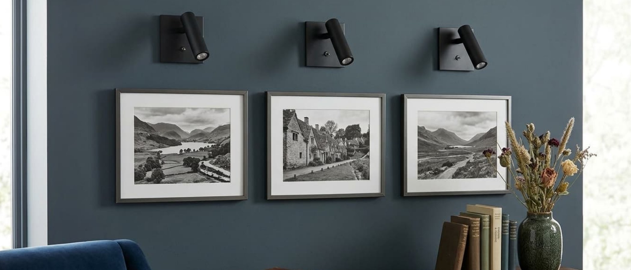 Slimlux adjustable wall lights above framed artwork