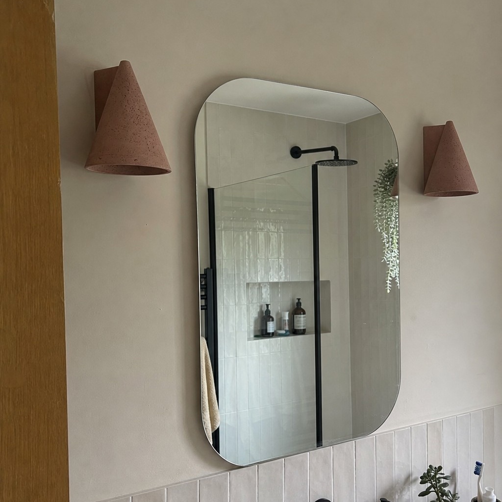 Customer bathroom scene with brick red wall lamps