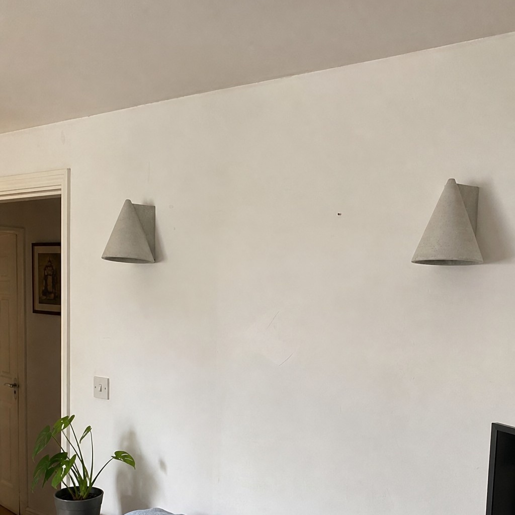 Pair of gray Concrellia wall lamps in a customer home