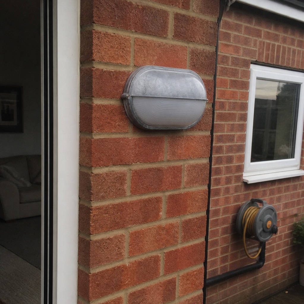 Customer installation of Docka wall sconce beside a window