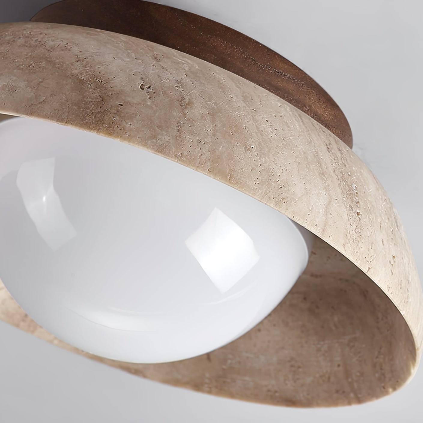 Close-up of bowl-shaped travertine ceiling light