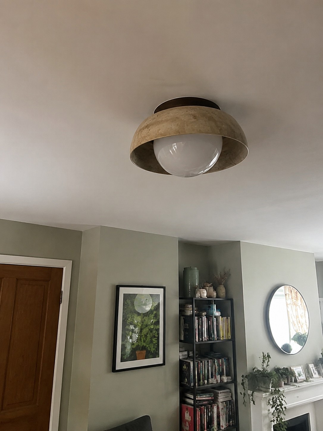 Customer room photo with travertine ceiling light