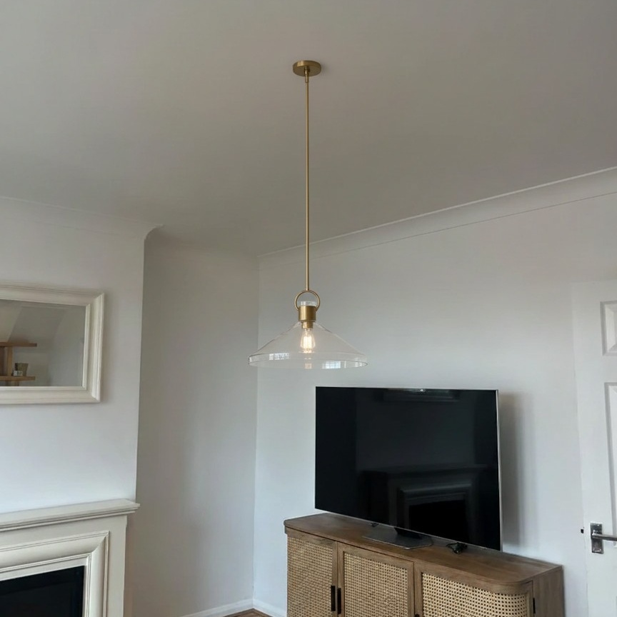 Customer photo of a brass Orvessa pendant light in a lounge