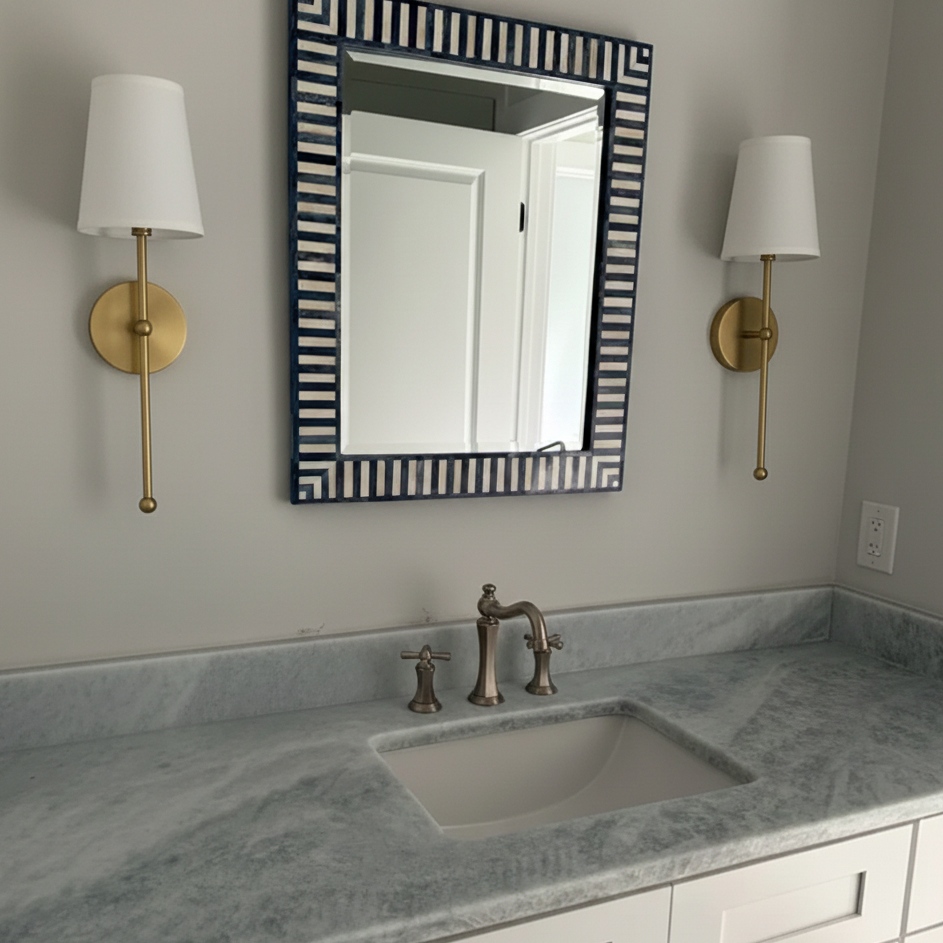 Meshara wall lamps in a bathroom vanity setting