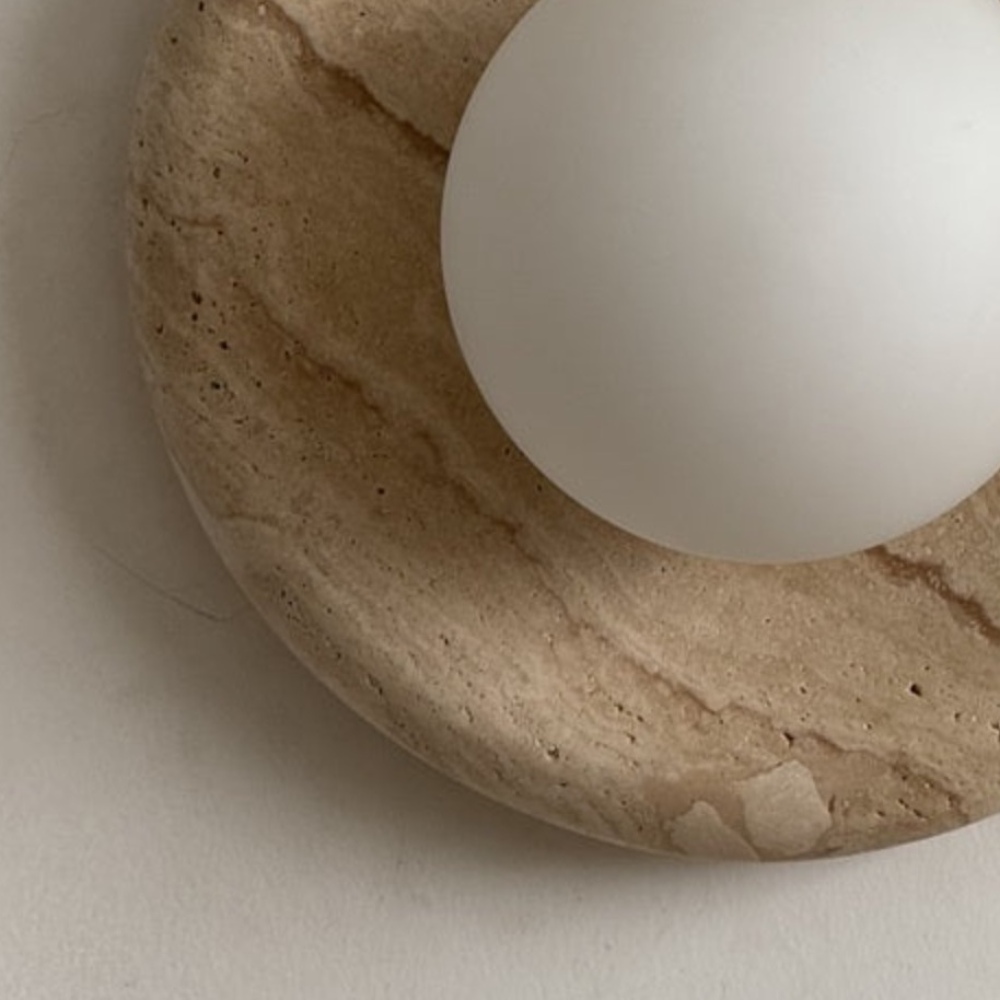 Close-up of Oria stone texture and glass shade