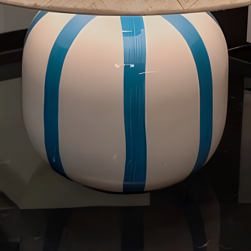 Close view of the blue and white ceramic lamp base