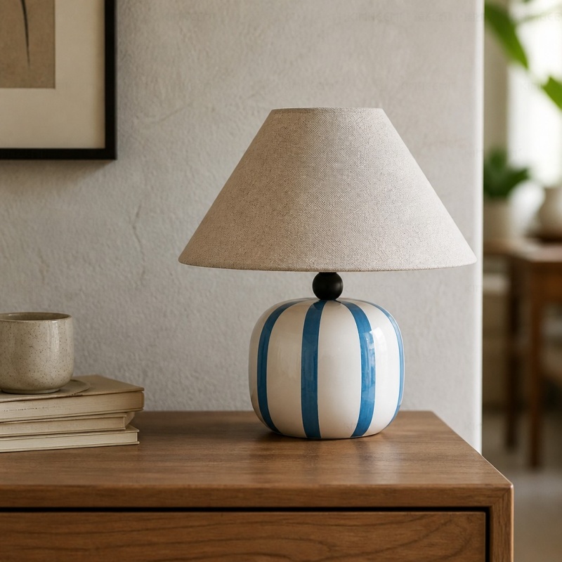 Ceruna table lamp displayed on a wooden cabinet